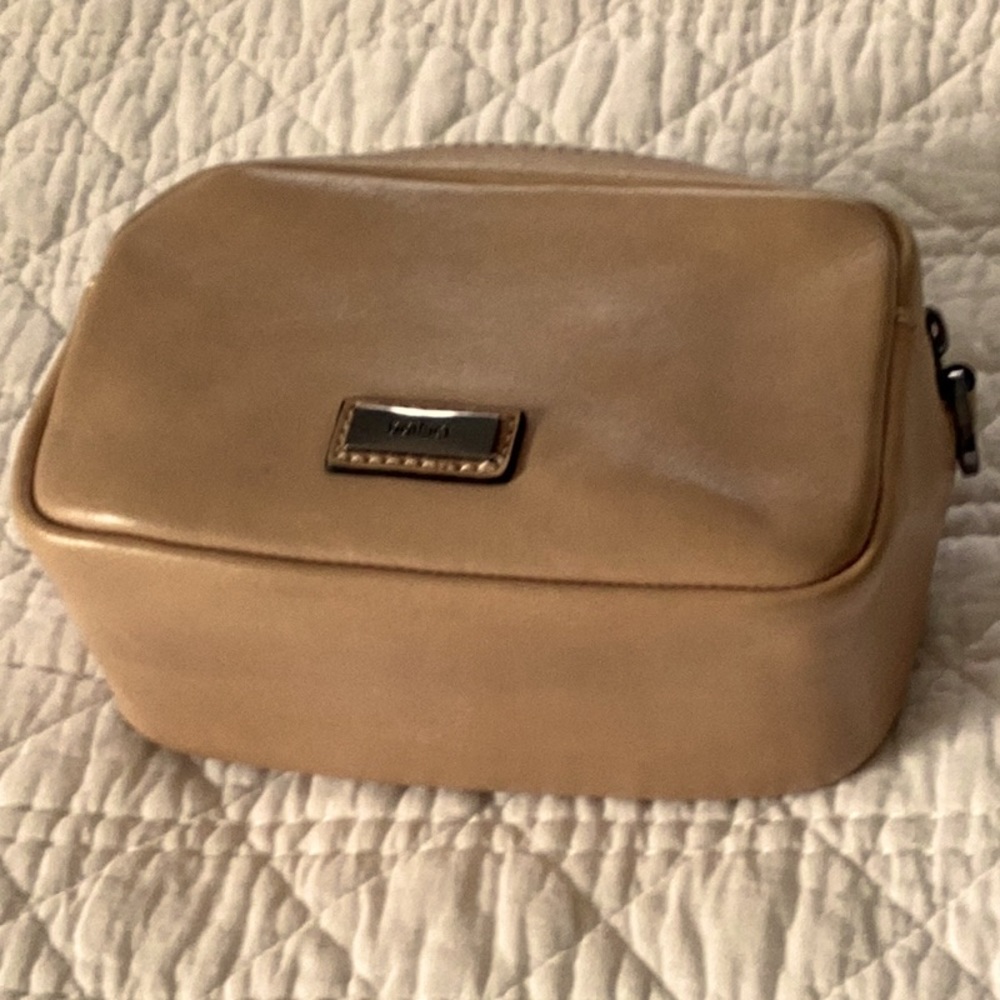 This is a belt bag or cross body all leather.